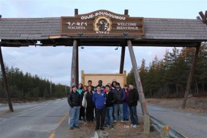 Group of YMCA Academy exchange students pose at the welcome sign to Oujé-Bougoumou, Quebec