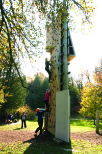 YMCA Academy students use the climbing wall at YMCA Cedar Glen Outdoor Centre