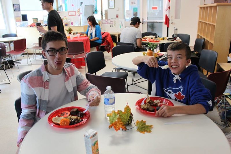 YMCA Academy students enjoying a meal during our Feast of Thanks Celebration