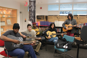 YMCA Academy students and teacher participate in Guitar Club