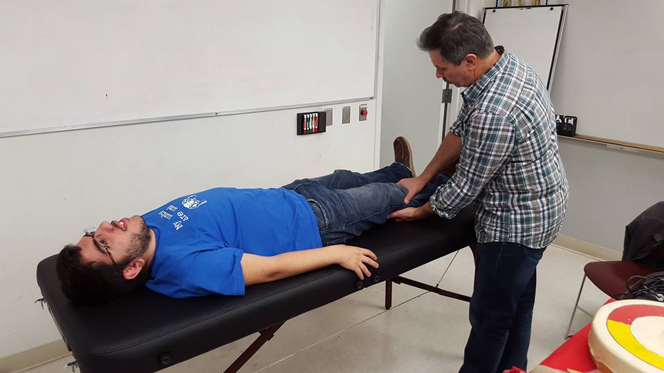 Jim Adams shows students complementary medicine methods such as massage therapy, meditation, acupuncture, and herbal remedies.