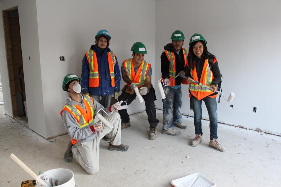 YMCA Academy students volunteering at a build site for Habitat for Humanity Holiday Campaign.