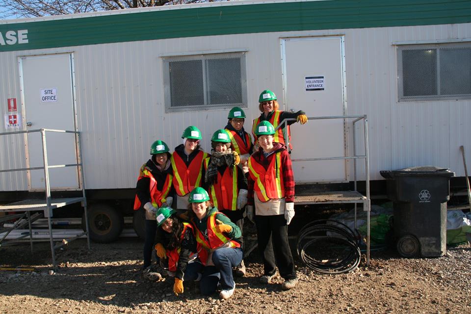 YMCA Academy students volunteering at a build site for Habitat for Humanity Holiday Campaign.