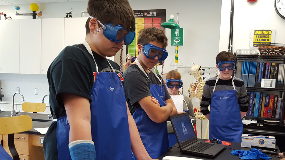 Students participate in a fetal pig dissection for Grade 10 Science class.