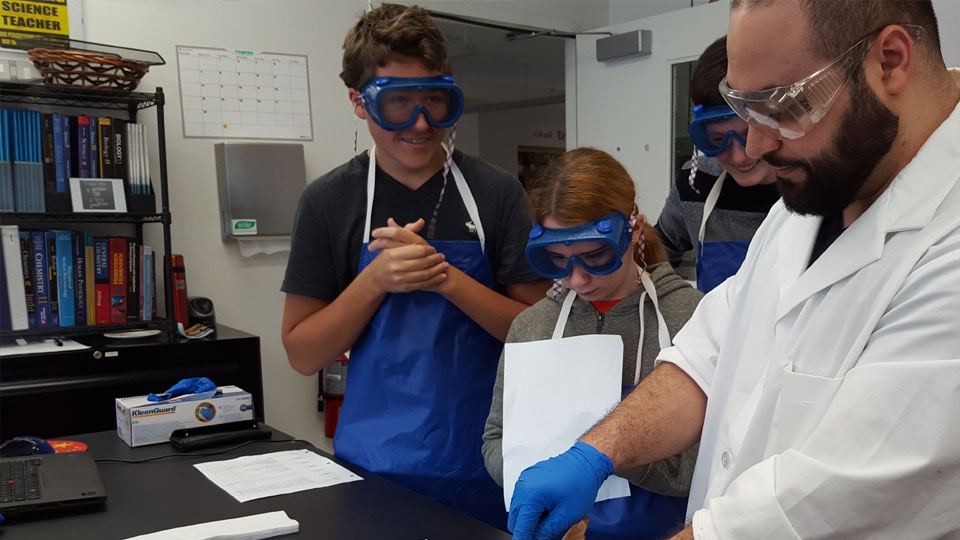 Students participate in a fetal pig dissection for Grade 10 Science class.