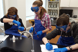 Grade 9 YMCA Academy Chemistry students explore properties of compounds.
