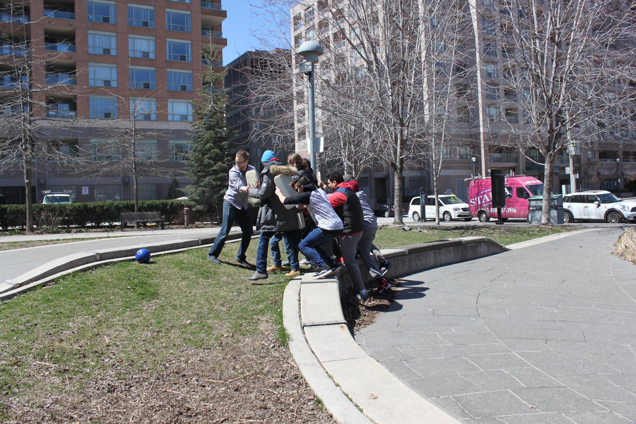 YMCA Academy students use a Roman shield formation.