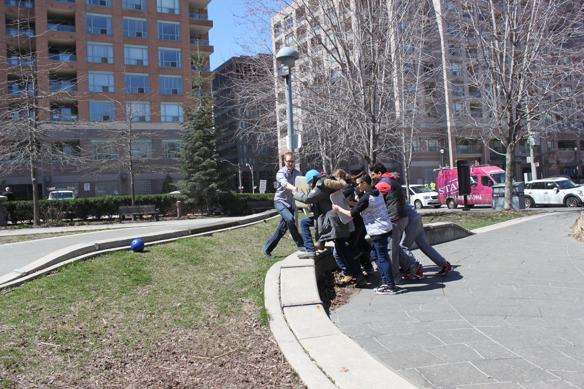 YMCA Academy students use a Roman shield formation.