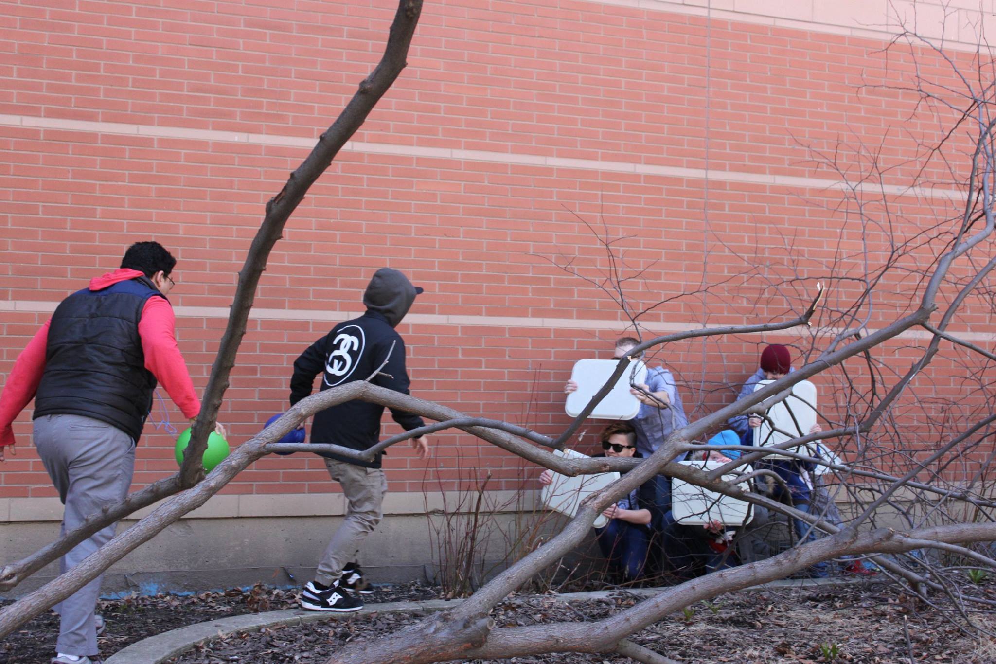 YMCA Academy students use a Roman shield formation.