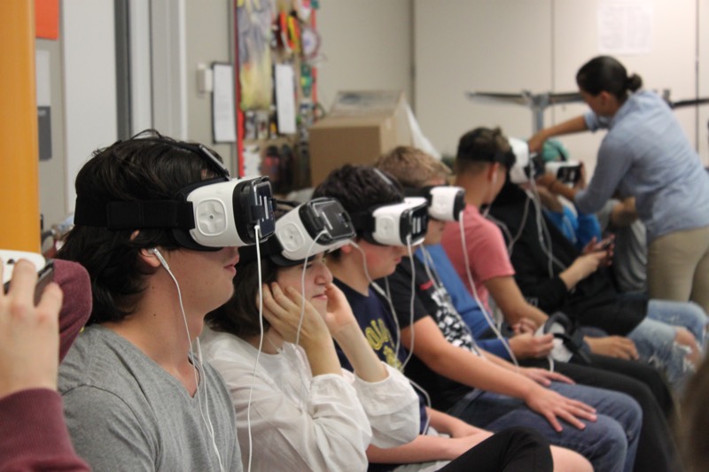 YMCA Academy students participate in a Virtual Reality experience named Clouds Over Sidra (2015, directed by Gabo Arora and Chris Milk)
