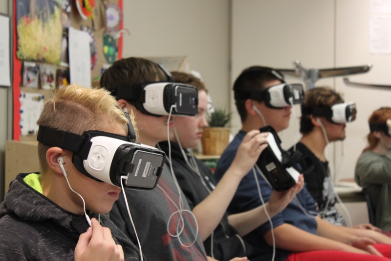 YMCA Academy students participate in a Virtual Reality experience named Clouds Over Sidra (2015, directed by Gabo Arora and Chris Milk)