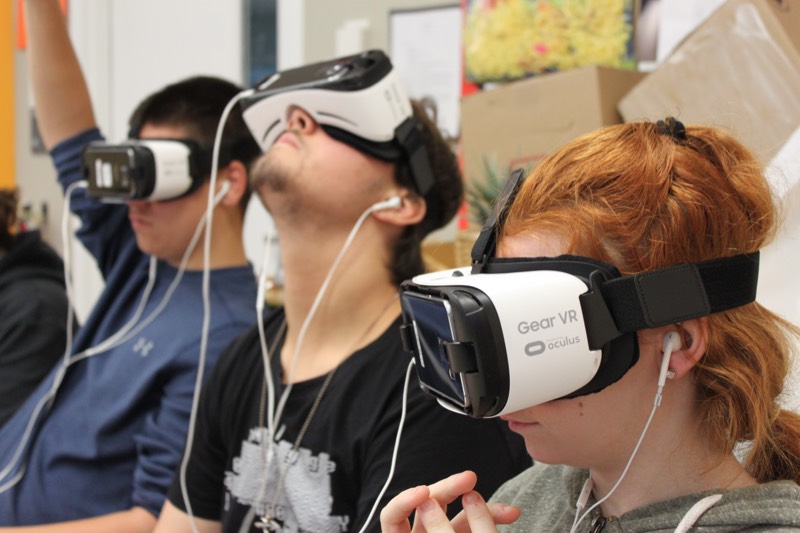 YMCA Academy students participate in a Virtual Reality experience named Clouds Over Sidra (2015, directed by Gabo Arora and Chris Milk)