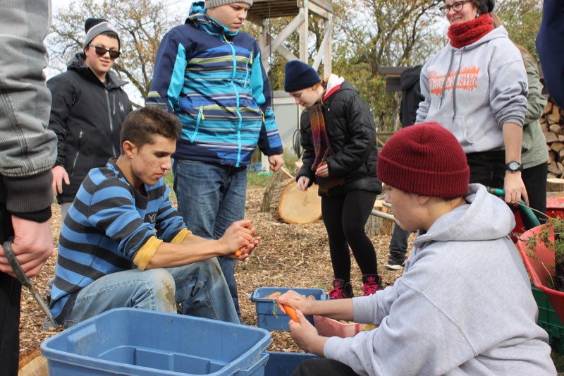 Cleaning vegetables from the farm at Cedar Glen