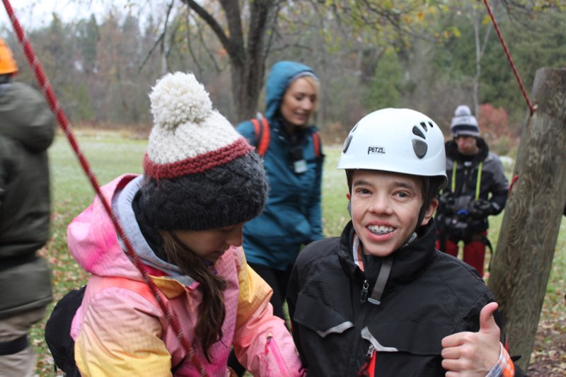 YMCA Academy students prepares for the rock wall at Cedar Glen