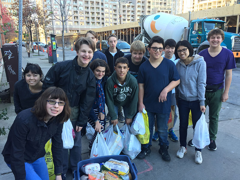 YMCA Academy students participate in the 'We Scare Hunger' Food Drive for the Fort York Food Bank.