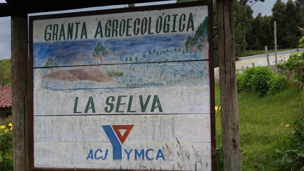 The sign outside the farm showing the name and the YMCA logo