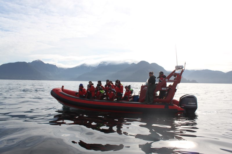 YMCA Academy students on a boat heading to an island