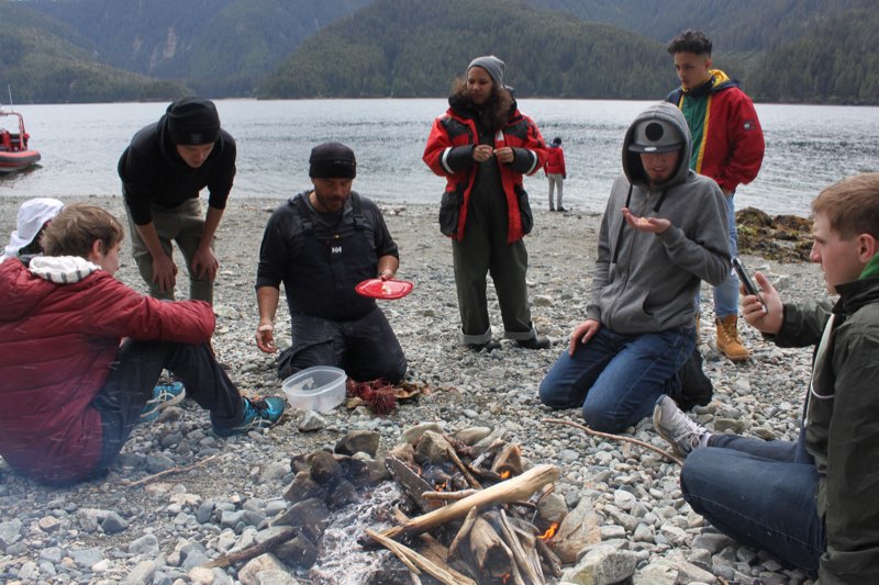 Camp Fire setup for lunch, and a demonstration of how to eat fresh sea food