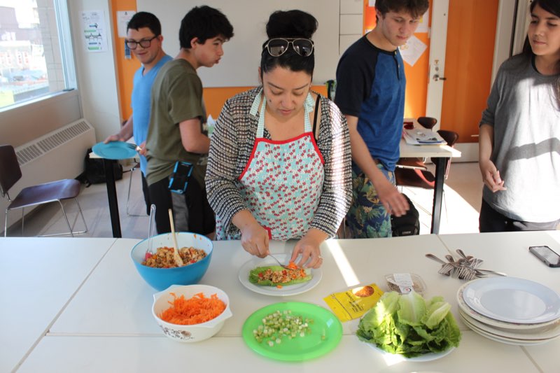 YMCA Academy students cooking during cooking club after school