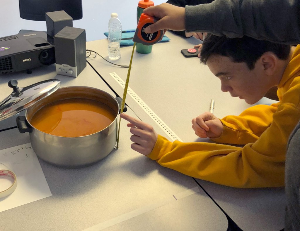 Academy students make Hot Sauce from fresh vegetables harvested from the community garden.