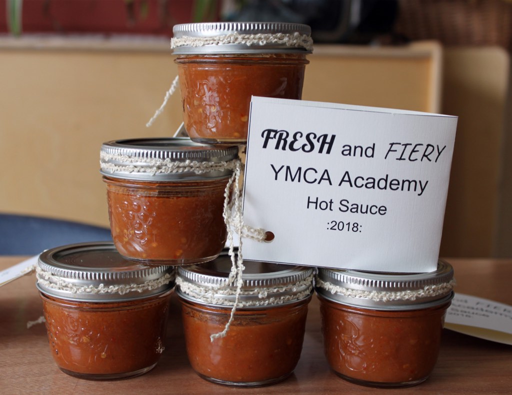 Academy students make Hot Sauce from fresh vegetables harvested from the community garden.