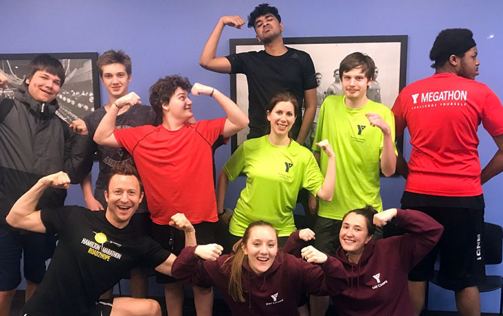 Academy students and staff pose during the Academy Rowing Crew’s 24-hour Row – Sweat for Good Challenge