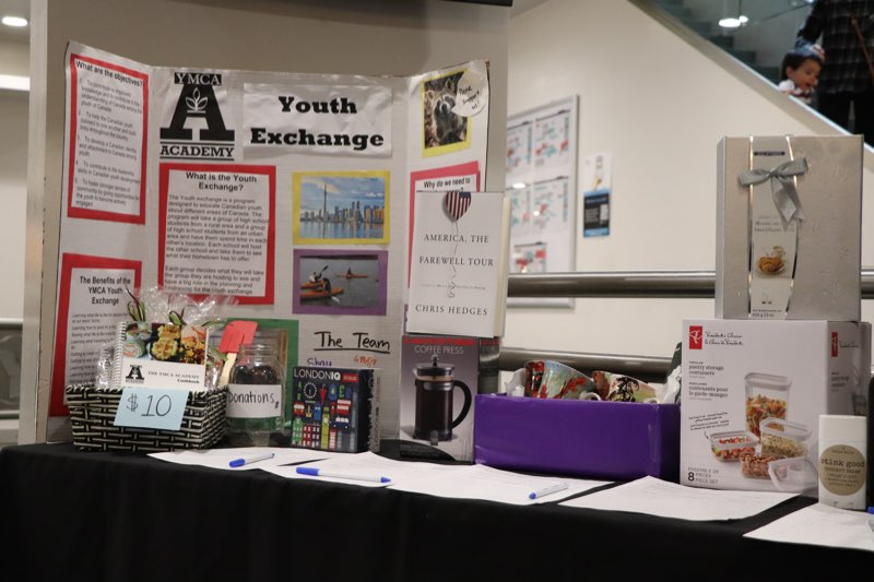 YMCA Academy students fundraising at the Youth Exchange Canada Silent Auction