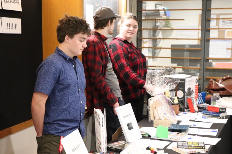 YMCA Academy students fundraising at the Youth Exchange Canada Silent Auction