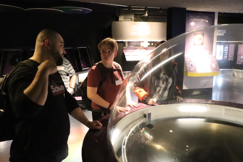 Students examine astronomy exhibits at the Ontario Science Centre