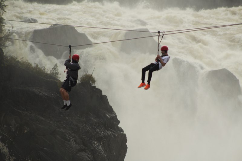 YMCA Academy exchange participants zip lining near Tobique River