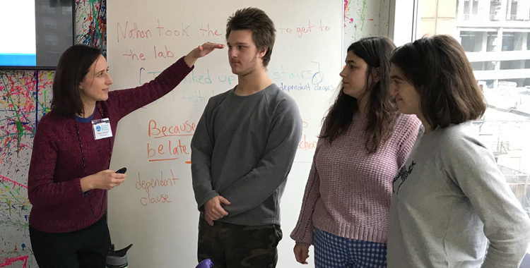 students in classroom participating in presentation