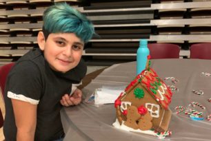 Academy Dance Committee Events A student with a Gingerbread house during a school dance