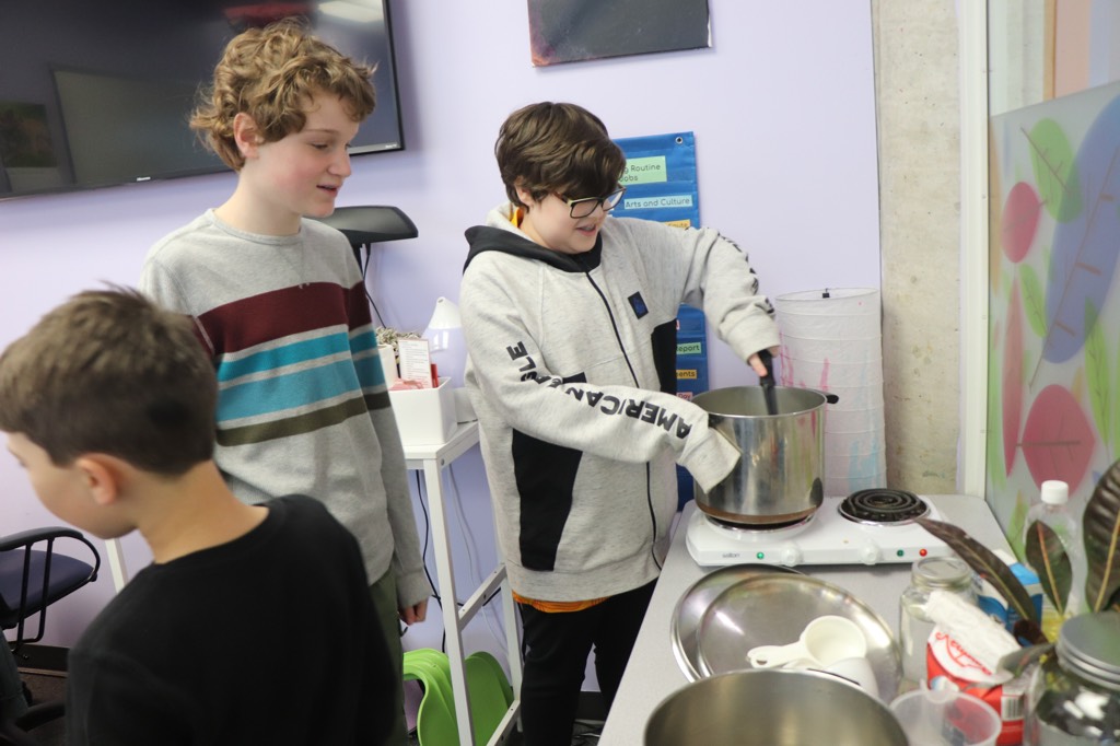 YMCA Academy middle school students create their famous batch of Hot and Fiery Hot Sauce