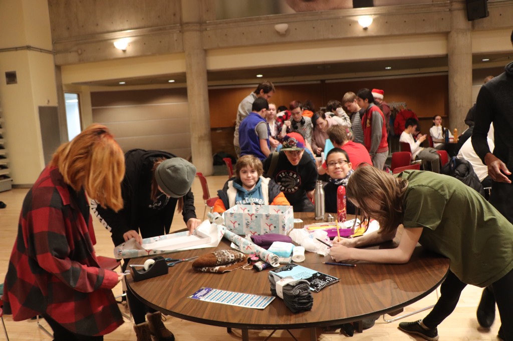 Students pack boxes for our second annual Shoebox Project initiative.