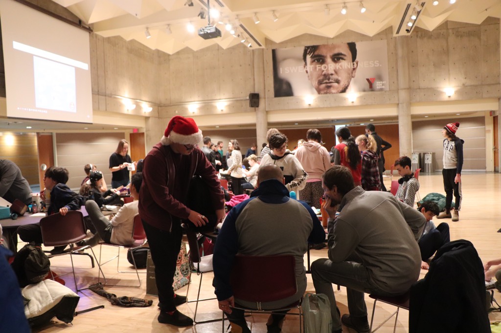 Students pack boxes for our second annual Shoebox Project initiative.