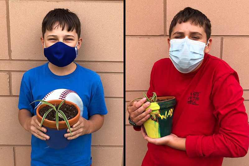 YMCA Academy Middle School students painting pots and planting their own plant