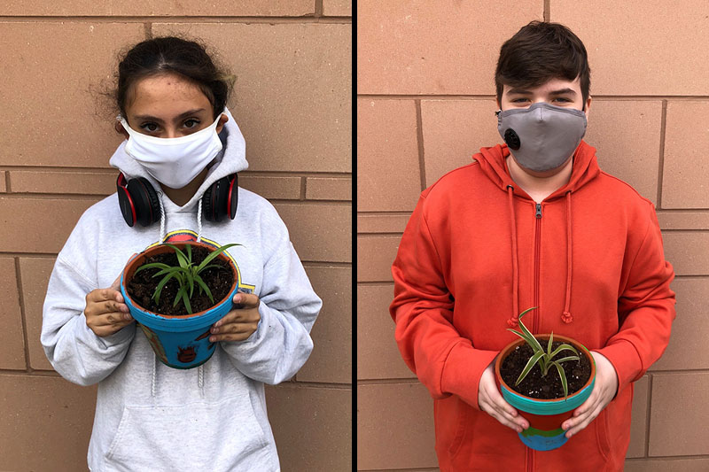 YMCA Academy Middle School students painting pots and planting their own plant