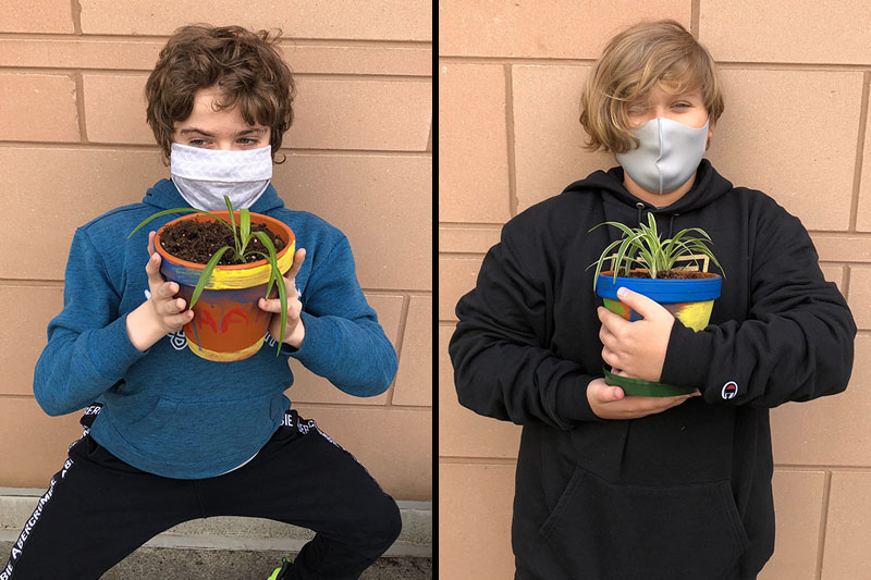 YMCA Academy Middle School students painting pots and planting their own plant