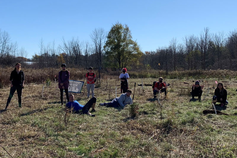 Academy students planting trees with the TRCA