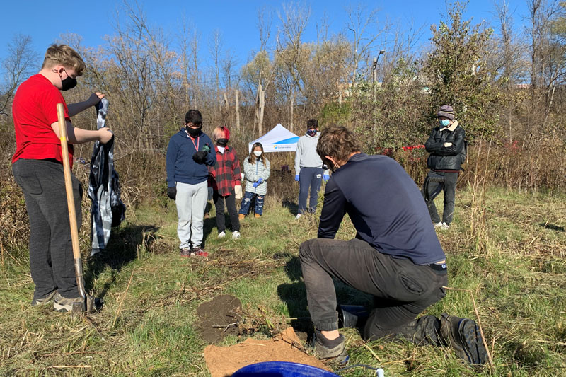 Academy students planting trees with the TRCA