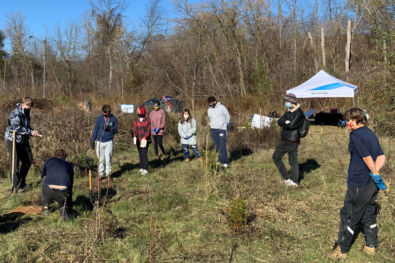 Academy students planting trees with the TRCA