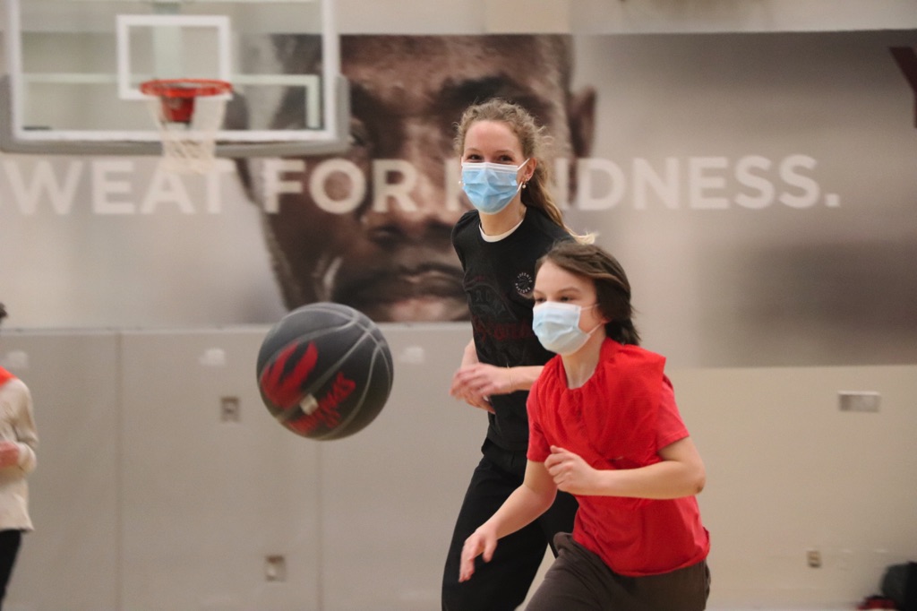 This day included fun activities such as designing a Toronto Raptors logo, slogan, or poster, and participating in “blindfolded basketball,” where the students used teamwork to help their classmates score a mini basket.