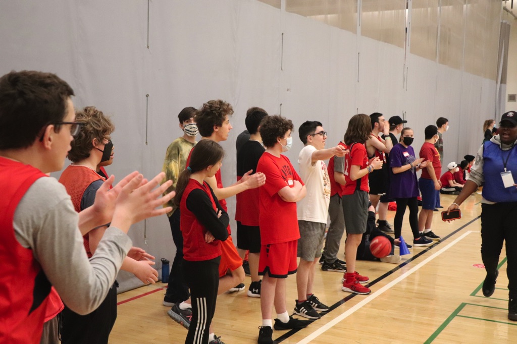 This day included fun activities such as designing a Toronto Raptors logo, slogan, or poster, and participating in “blindfolded basketball,” where the students used teamwork to help their classmates score a mini basket.