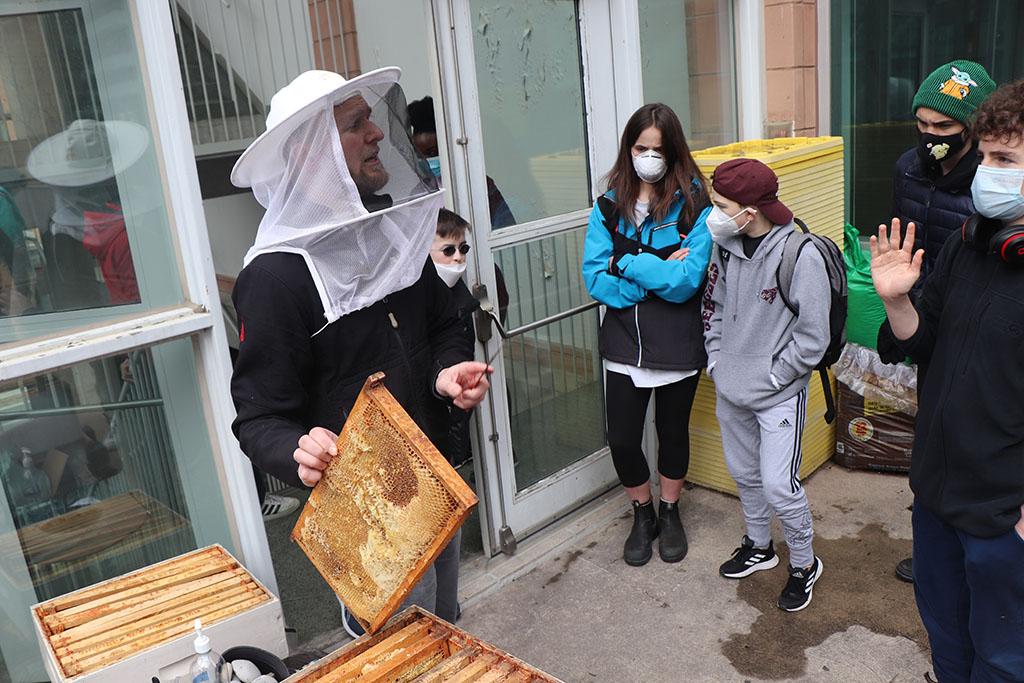 This spring the Academy High School students got a glimpse into the life of a beekeeper. Academy teacher and hobby beekeeper, Brandon, brought in an empty hive and beekeeping equipment to demonstrate some of the jobs of a beekeeper.