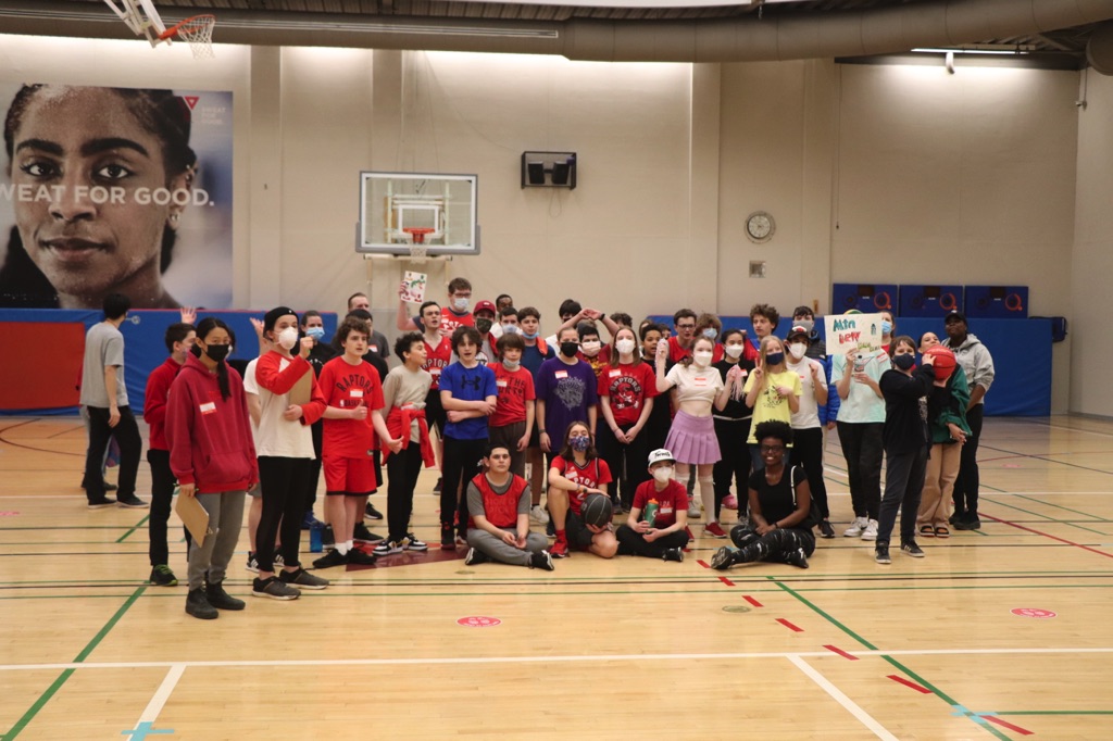 This day included fun activities such as designing a Toronto Raptors logo, slogan, or poster, and participating in “blindfolded basketball,” where the students used teamwork to help their classmates score a mini basket.