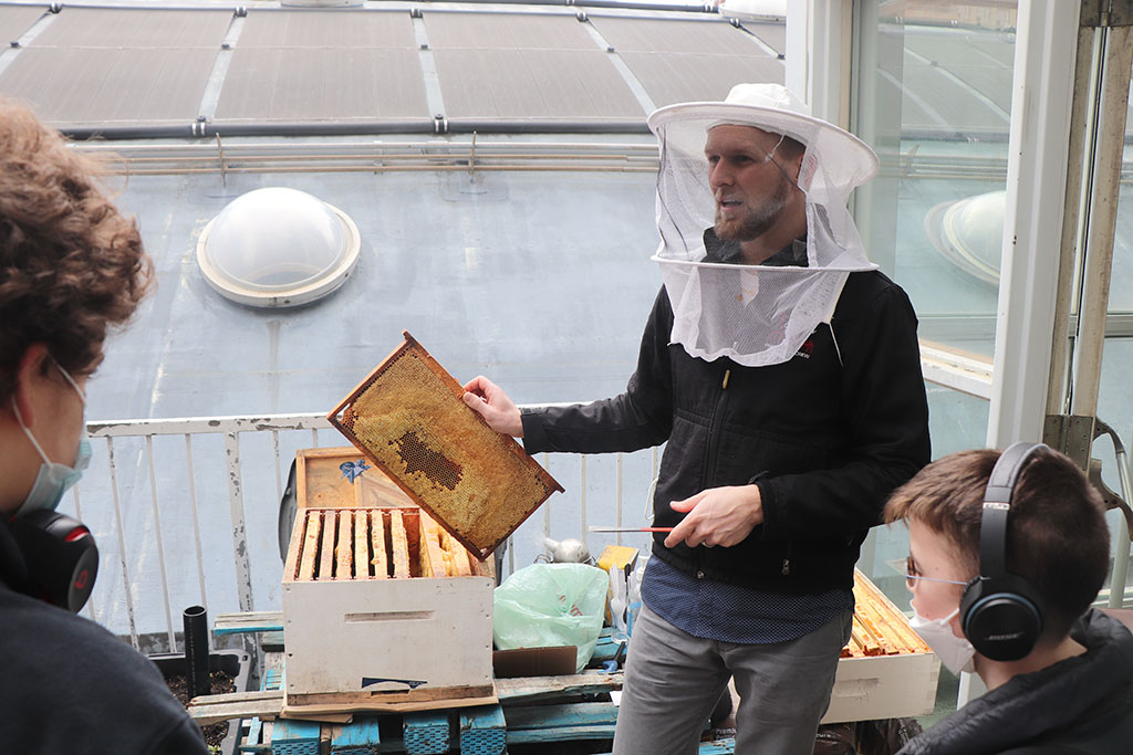 This spring the Academy High School students got a glimpse into the life of a beekeeper. Academy teacher and hobby beekeeper, Brandon, brought in an empty hive and beekeeping equipment to demonstrate some of the jobs of a beekeeper.