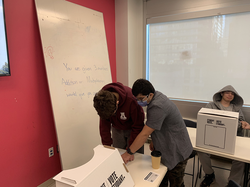 The two Civics classes in the Academy have joined together to work with Student Vote Canada to bring a realistic voting experience to the school.