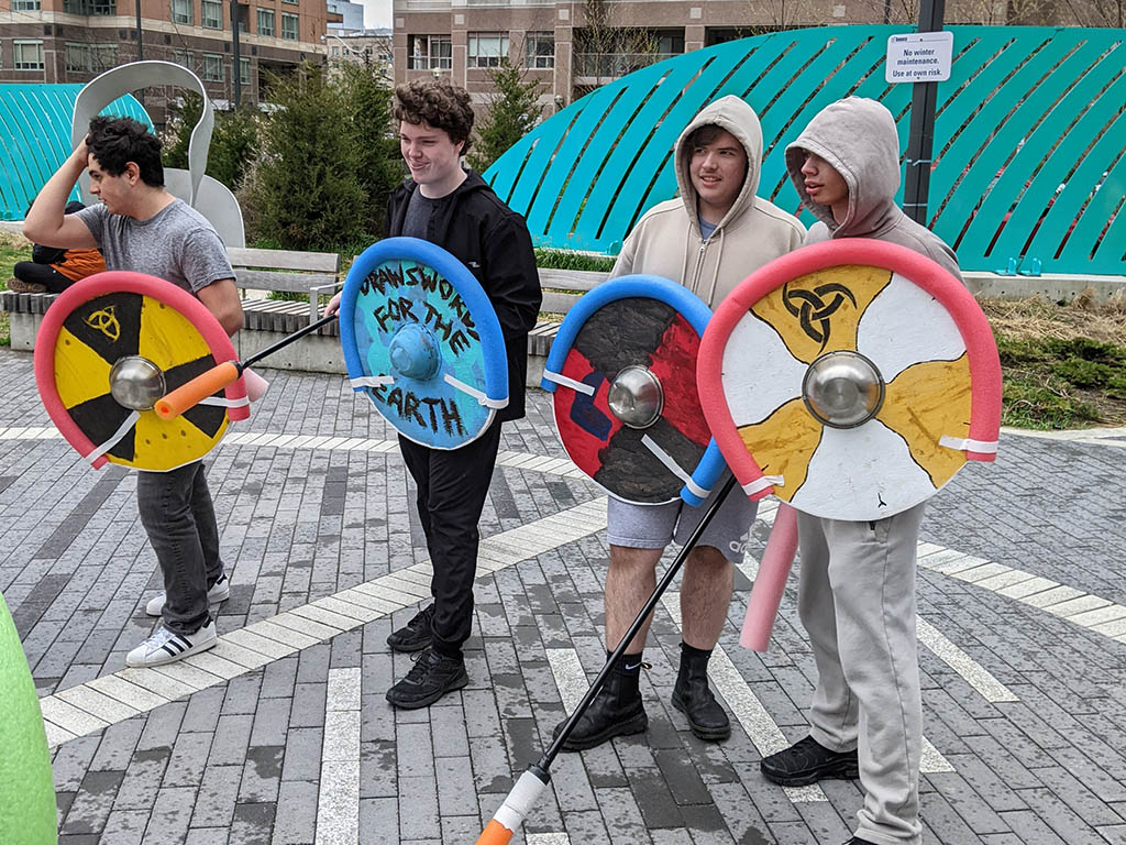 The Grade 12 Adventures in World History class engaged in some hands-on-experiential learning in the park near YMCA Academy. Students have been learning about the adventures of Norwegian, and Danish societies of the Viking Age roughly one thousand years ago.