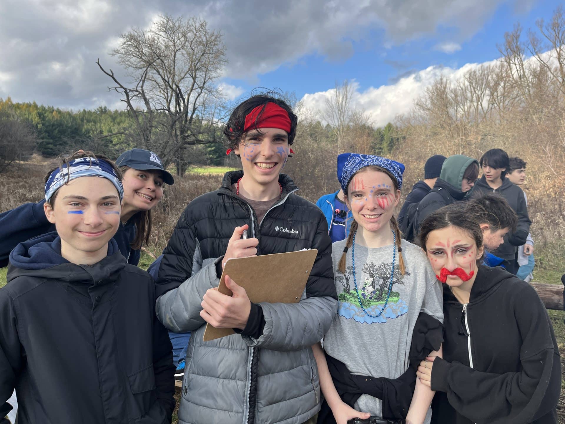 Group of students in costume during YMCA Academy Spirit Week outdoor activity.