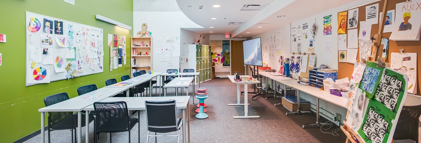 Bright YMCA Academy classroom with colorful walls and learning materials.